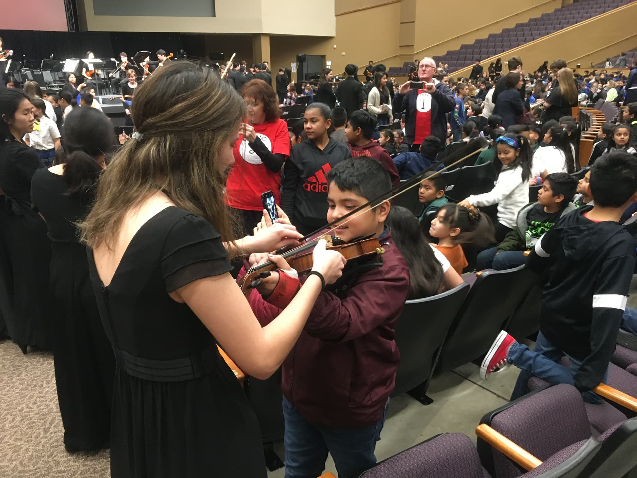 Musician Helping Student Play